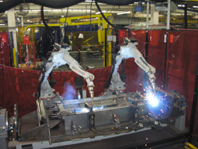 Image of automatic robots actively welding