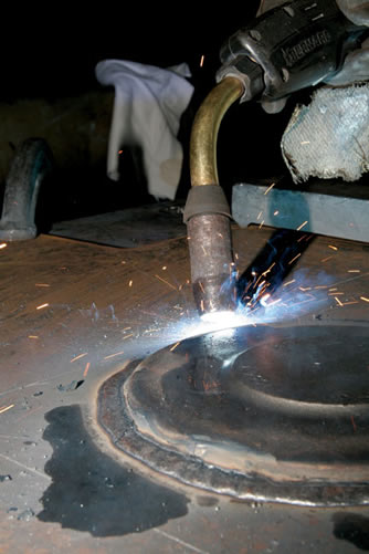 Image of a proper way to weld with a MIG gun