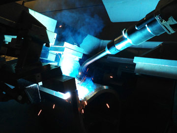 Image of robotic MIG welding gun in action