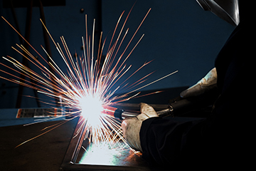 Image of a welder in a semi-automatic application
