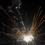 Robotic MIG welding gun with AccuLock R consumables in action