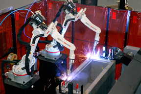Image of two robots in a welding cell, set-up properly