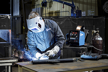 Image of welder with semi-automatic MIG gun welding