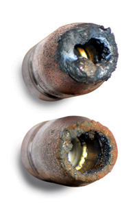 Image of spatter buildup on two nozzles 